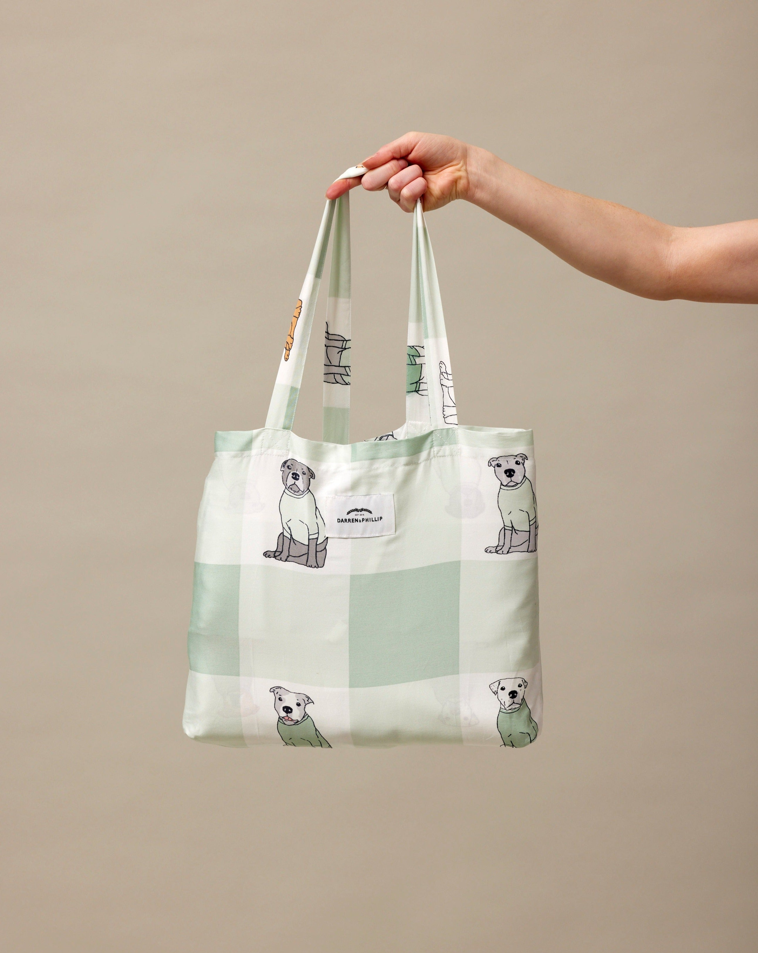 Darren and Phillip printed dog bedding in self-bag.
