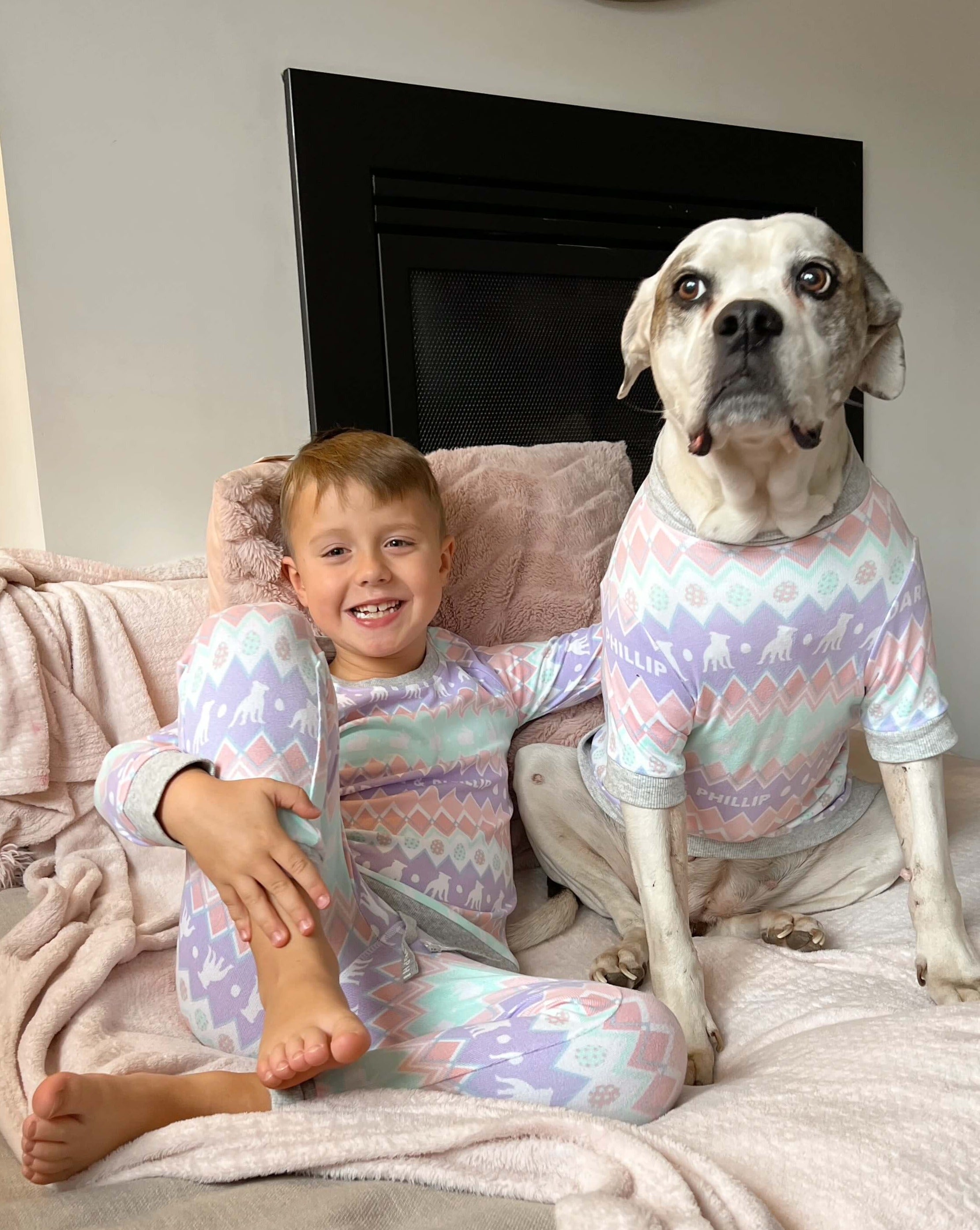 A boy and his dog in match your dog Easter pyjamas from Darren and Phillip.