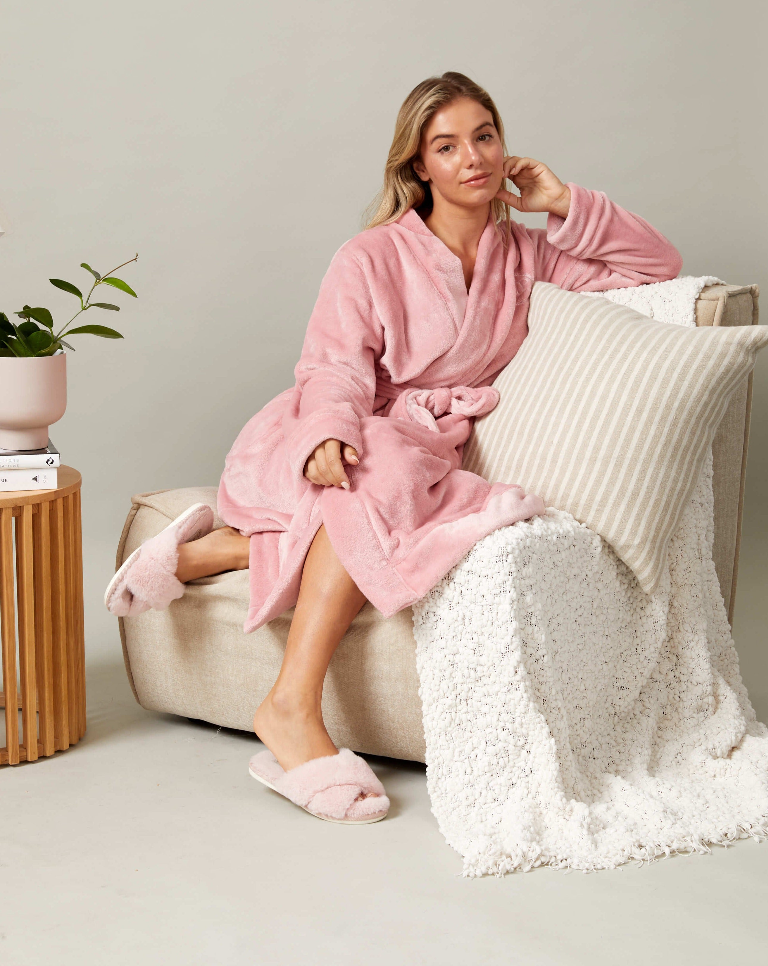 The women's pink fluffy match your dog robe from Darren and Phillip.